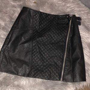 Black leather skirt with 2 buckles on top left top